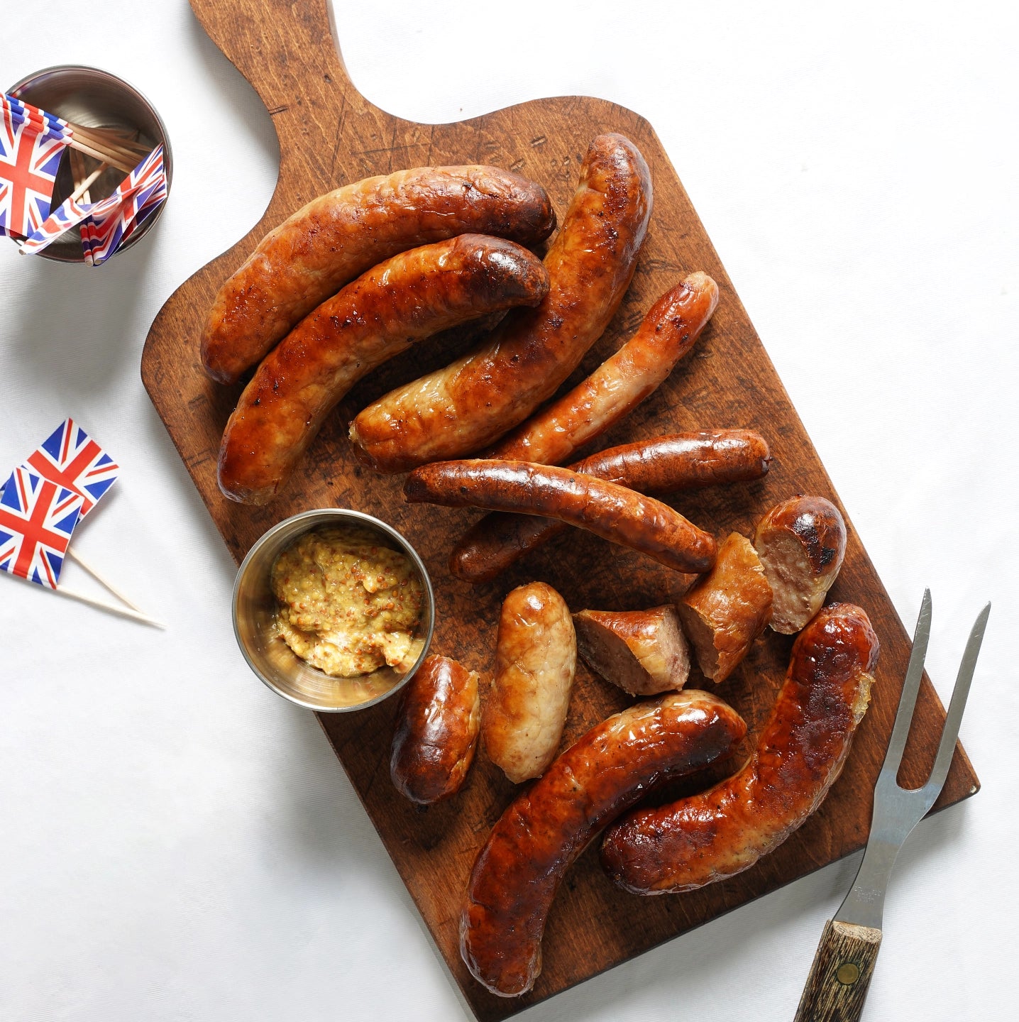 Butcher's box of assorted bangers on a cutting board